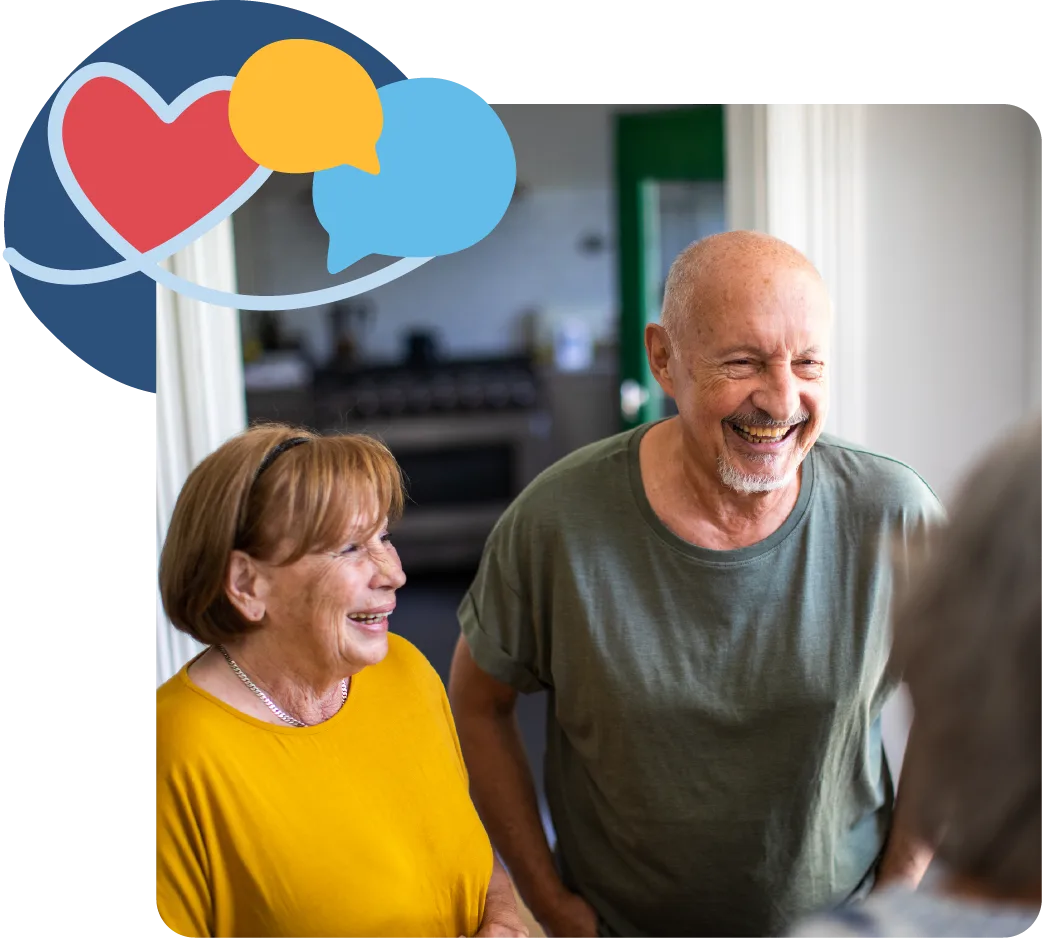 Elderly couple smiling indoors with a heart icon displayed above them